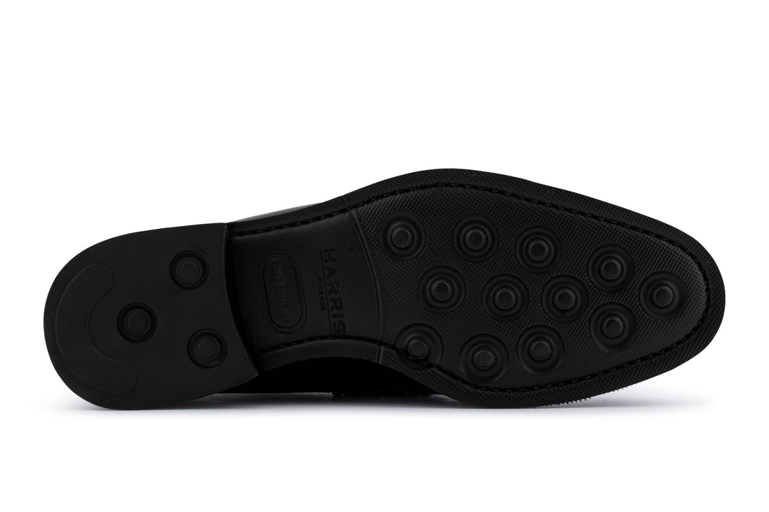 Schwarzer Mokassin aus bedrucktem Leder