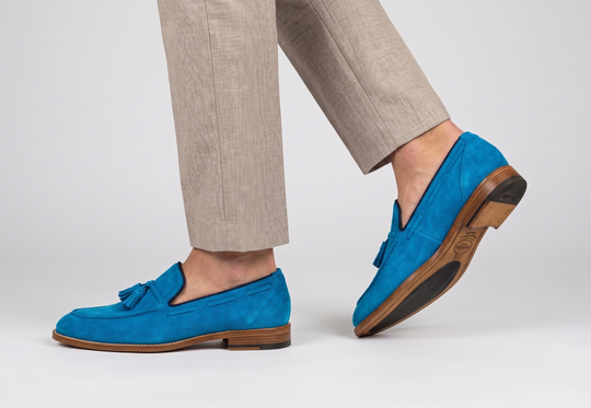 Mocassino in suede con pon pon
